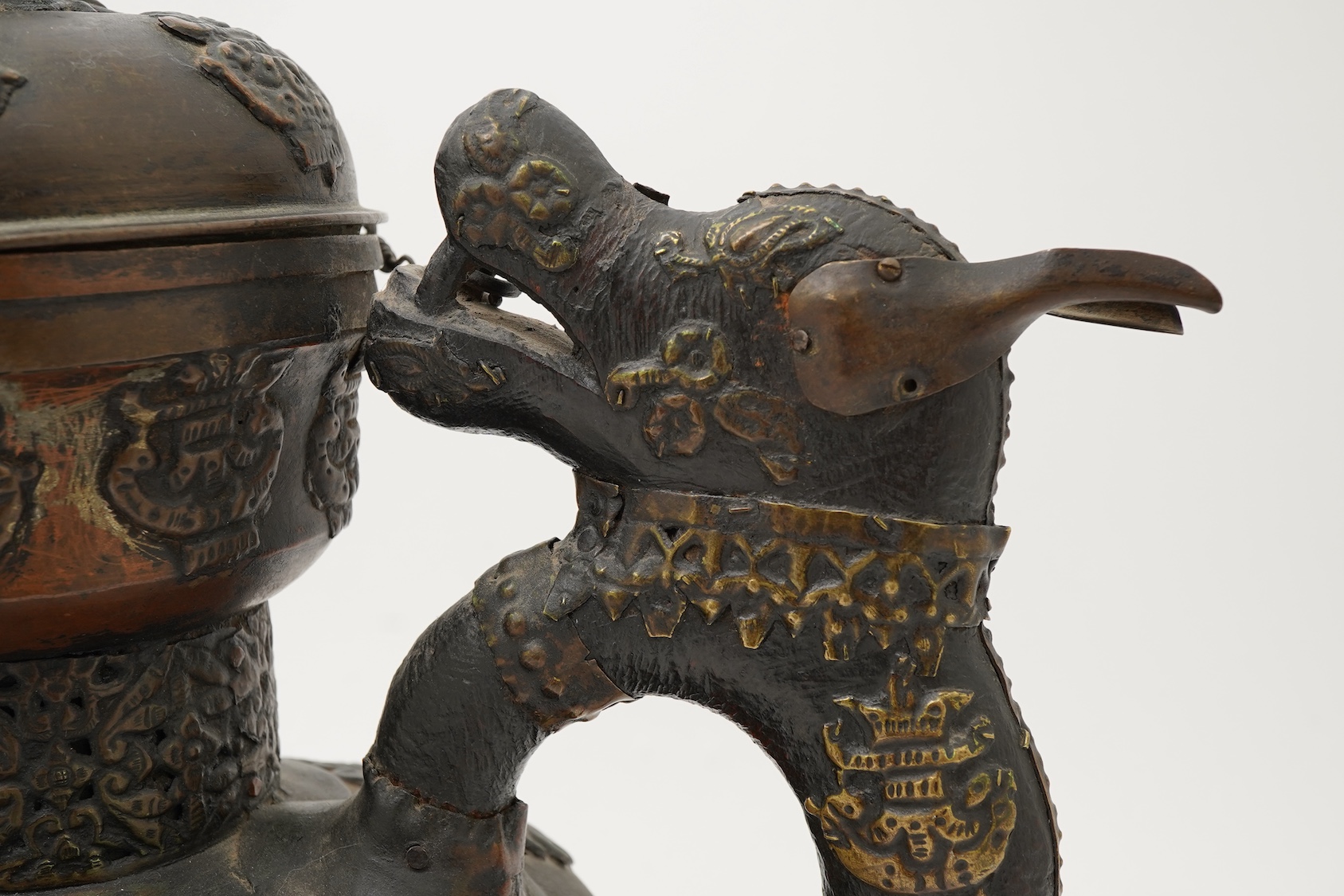 A large Tibetan repoussé brass and copper ewer, 19th century